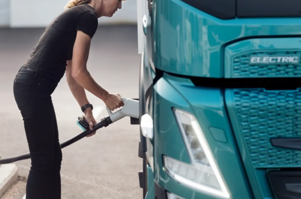 woman electric charging a lorry